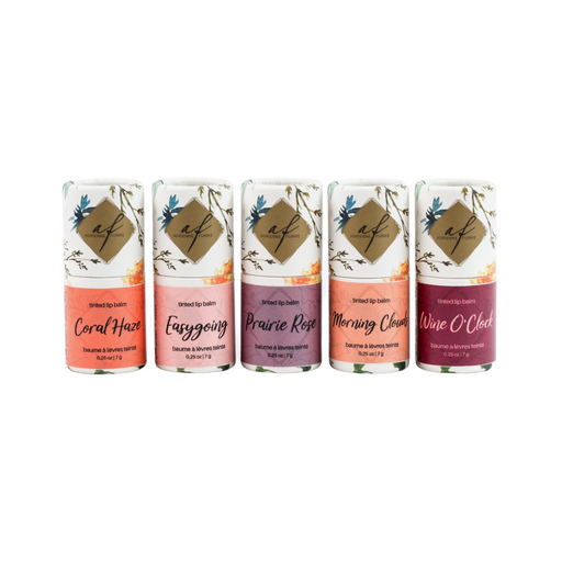 A collection of five tinted lip balms in various colors.