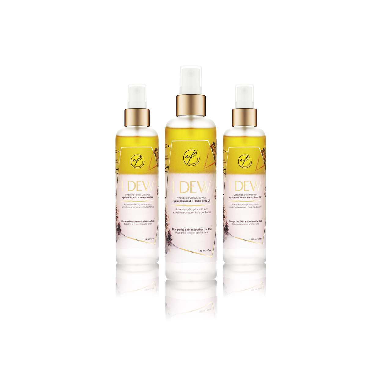 Three facial mist spray bottles labeled 'I Dew' containing a hyaluronic acid and hemp seed oil-based hydrating facial mist, positioned against a white background.