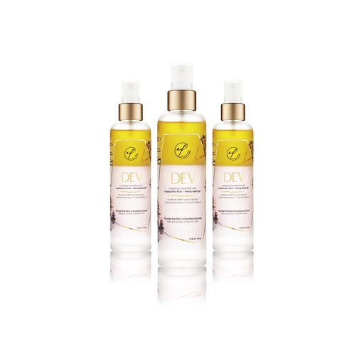 Three facial mist spray bottles labeled 'I Dew' containing a hyaluronic acid and hemp seed oil-based hydrating facial mist, positioned against a white background.